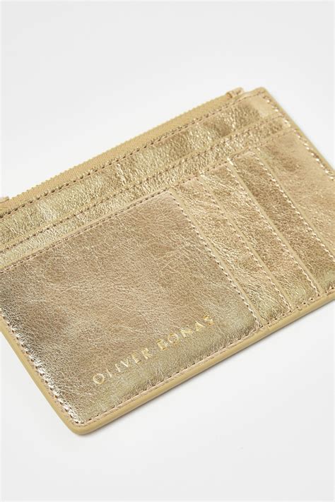 oliver bonas gold rita card holder.